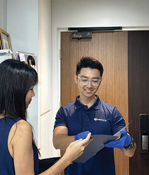 Envico cleaning consultant discussing customized cleaning plan with client in Singapore